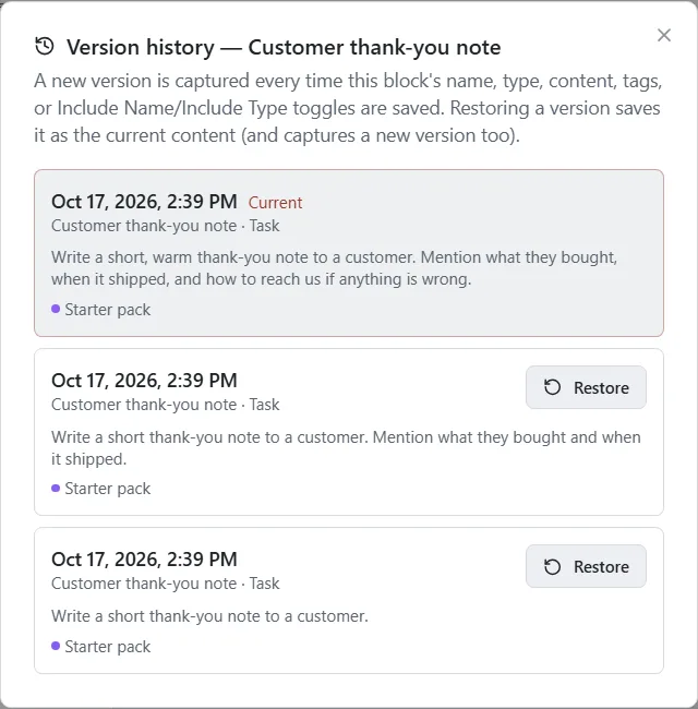 The Version history window listing three versions of a block, newest first with Current beside it, and a Restore button on the older ones.